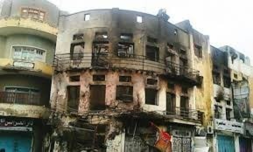 صورة العمارة محترقة في 2015(منصات التواصل)